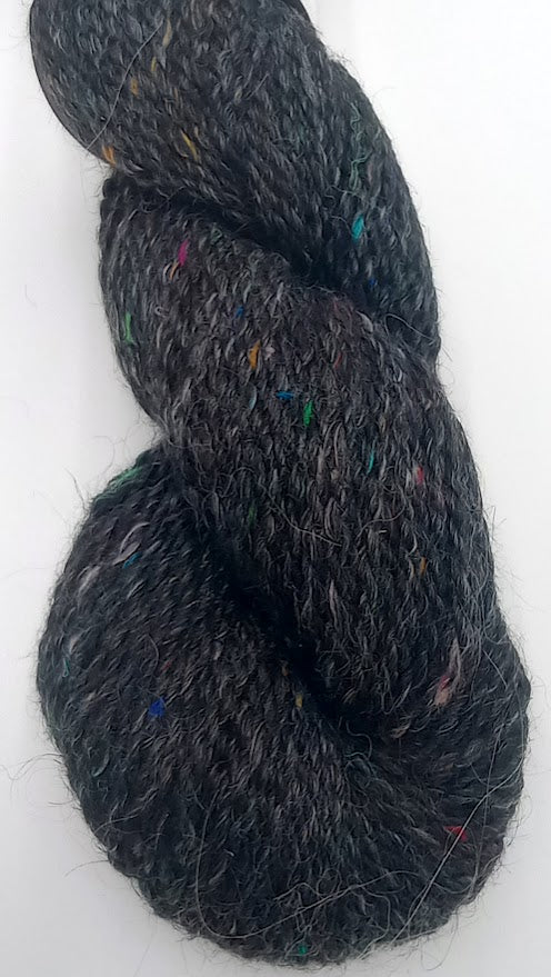 Stella Confetti – True Black Suri Alpaca Worsted Yarn with Rainbow Silk – Fehrenbach Fibers